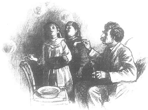 Clemens blowing bubbles with his daughters
